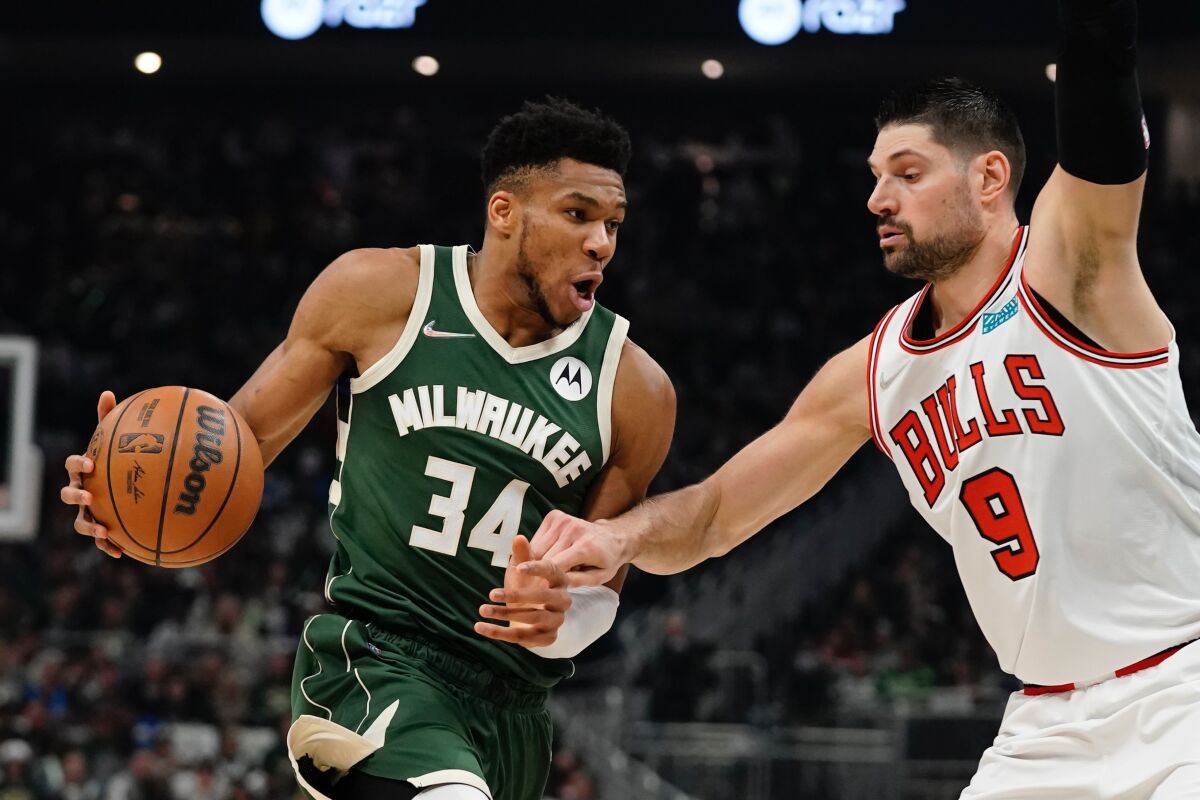 Milwaukee Bucks' Giannis Antetokounmpo drives past Chicago Bulls' Nikola Vucevic.