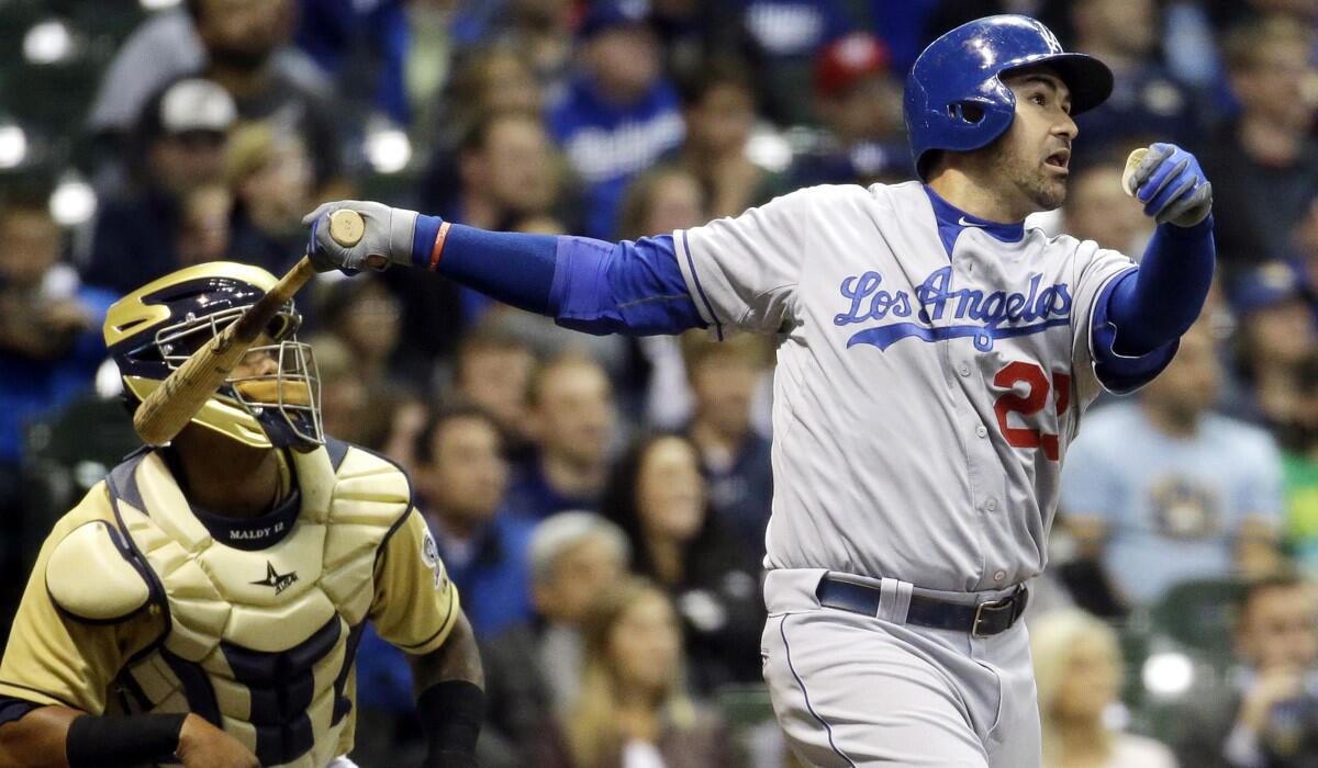 Los Angeles Dodgers' Adrian Gonzalez hits a two-run home run during the seventh inning against the Milwaukee Brewers on Tuesday.