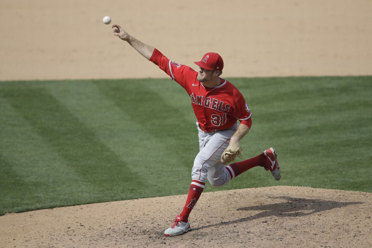 Angels pitcher Ty Buttrey works against the Athletics during the ninth inning Aug. 22, 2020.
