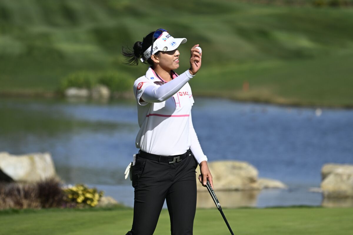 Atthaya Thitikul of Thailand waves to the gallery after finishing her victory at the LPGA's JTBC Classic in March at Aviara.