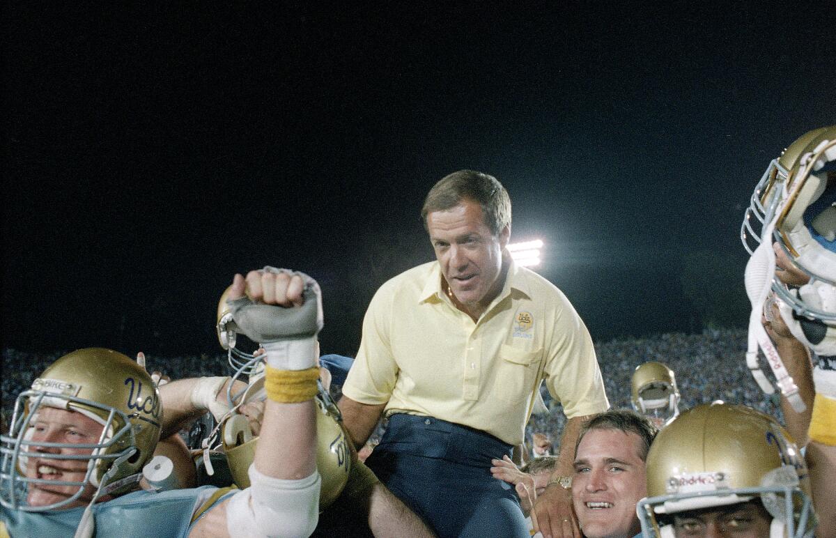 UCLA coach Terry Donahue is carried off the field after the Bruins defeated Nebraska at the Rose Bowl in 1998.