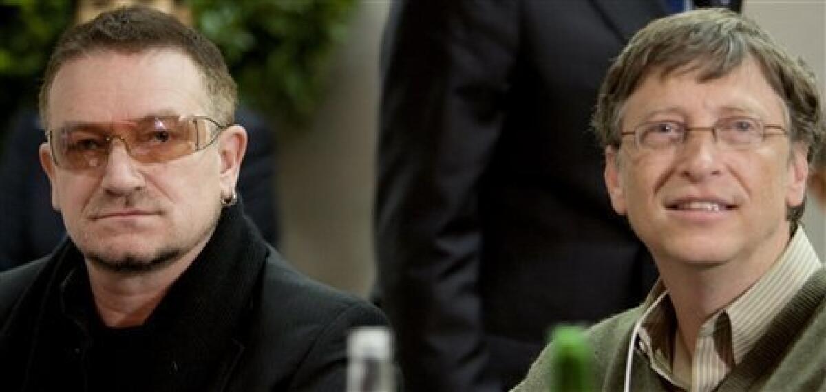 FILE This is a Saturday Jan. 26, 2008, file photo of Irish musician Bono, left, and Chairman of Microsoft Corporation, Bill Gates, are seen at the start of a meeting at the World Economic Forum, in Davos, Switzerland, (AP Photo/Peter Dejong, Pool, File)