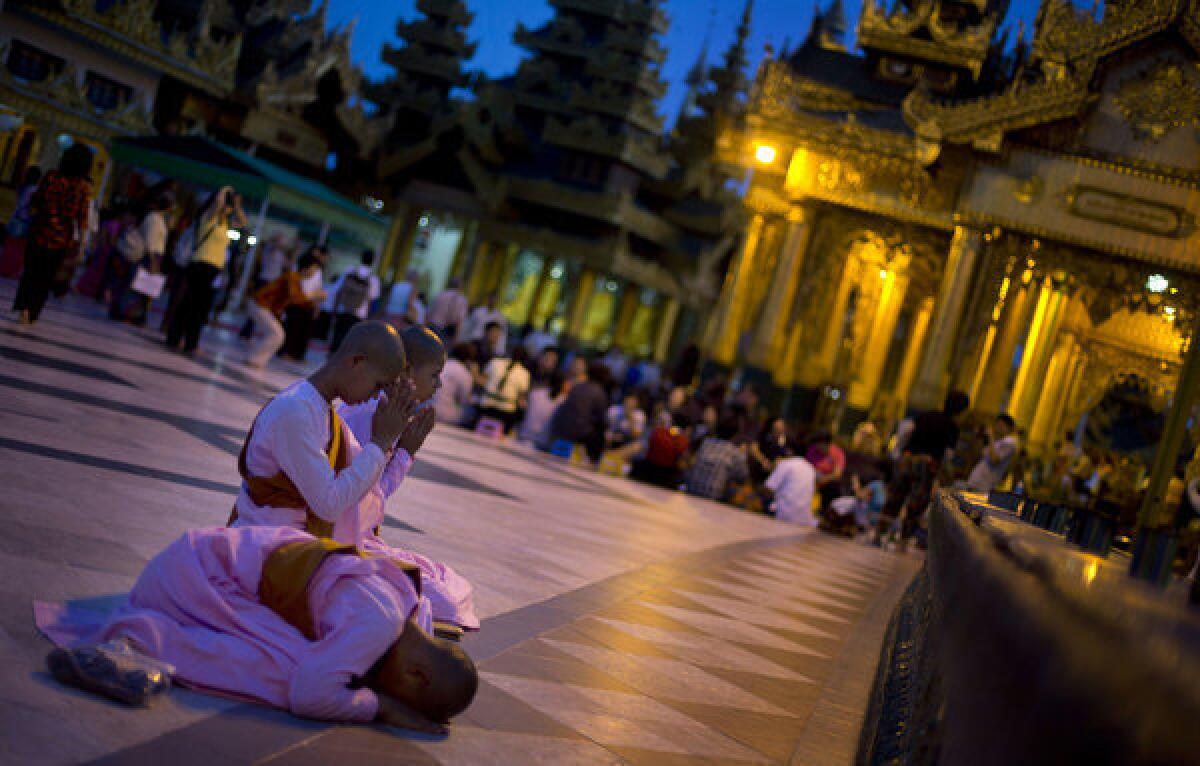 Novice Buddhist nuns perform religious rituals at Shwedagon Pagoda in Yangon, Myanmar, on Wednesday.