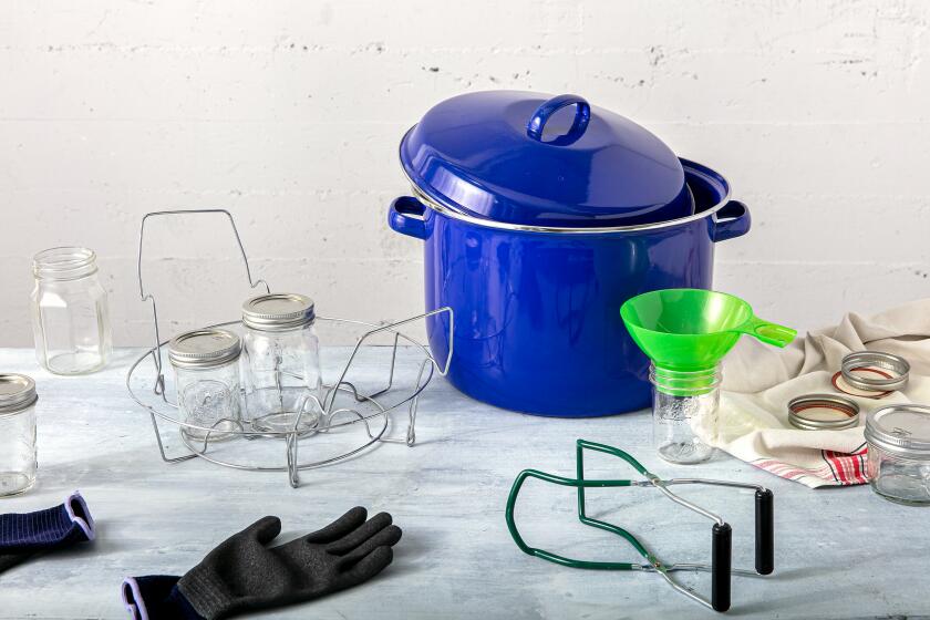 LOS ANGELES, CALIFORNIA, July 5, 2021: Equipment one trully needs - a canning pot with rack, a jar funnel, a jar clamp/tong, banded jars, and gloves (dishwashing gloves or heat-proof gloves) for a July Jam Guide story by Ben Mims, photographed on Monday, July 5, 2021, at Proplink Studios in Arts District Los Angeles. (Photo and Prop Styling / Silvia Razgova, Additional Prop Styling / Sean Bradley, Food styling / Ben Mims) ATTN: 804045-la-fo-cooking-jams