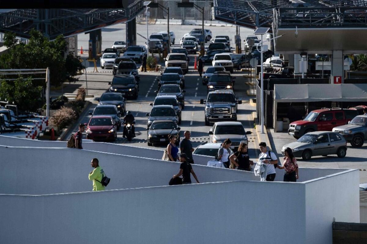 Travelers cross into Mexico at the El Chaparral Port of Entry in Tijuana.