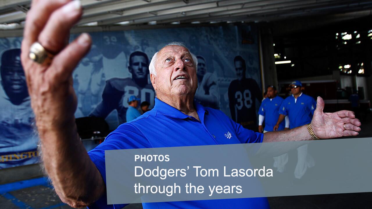 Former Dodgers manager Tom Lasorda speaks with fans while attending a UCLA football game at the Rose Bowl in 2011. Lasorda, the second longest-serving manager in franchise history, has been involved with the Dodgers organization for more than six decades.