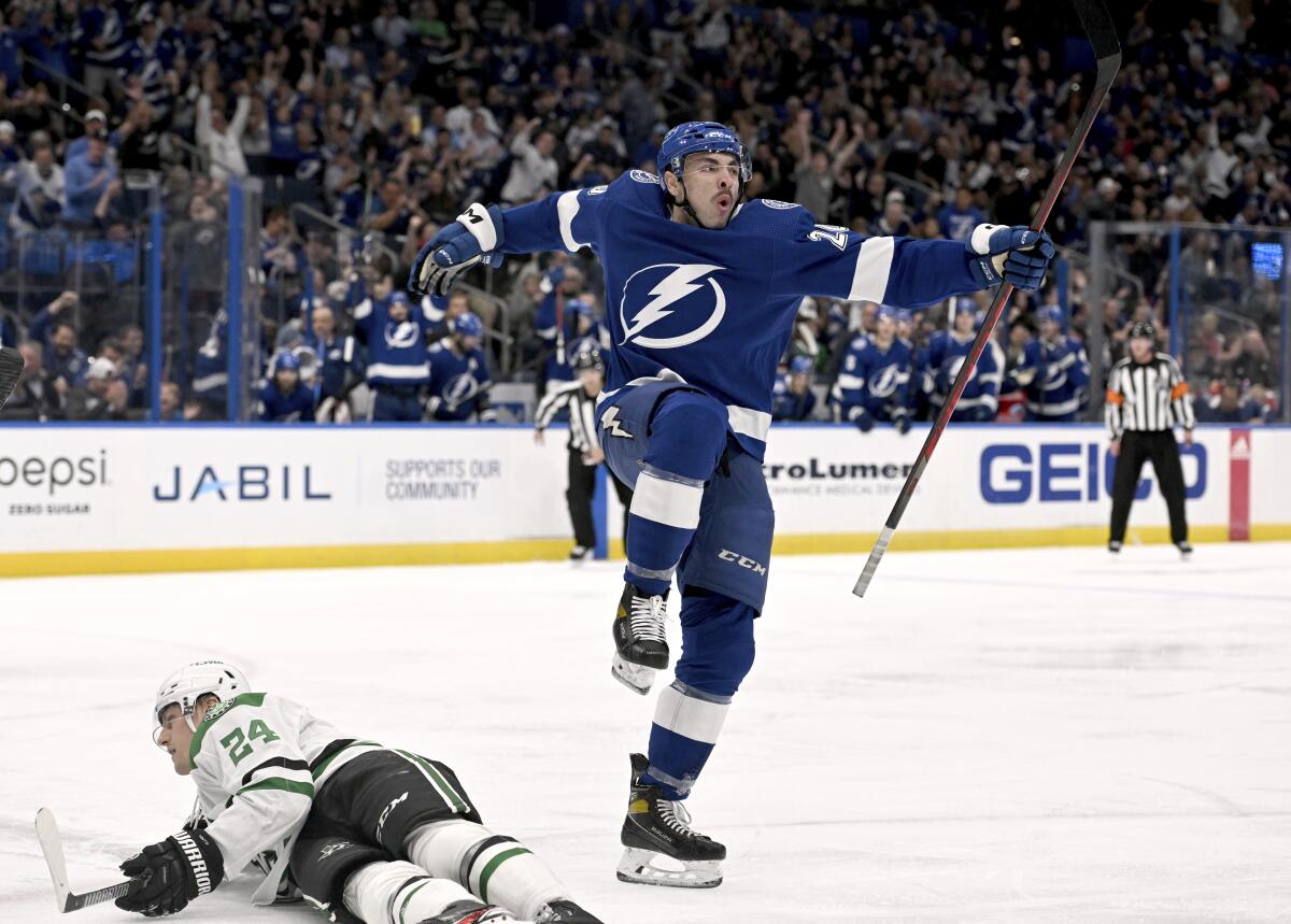 Tampa Bay Lightning left wing Nicholas Paul (20) celebrates his second-period goal, next to Dallas Stars' Roope Hintz during an NHL hockey game Tuesday, Nov. 15, 2022, in Tampa, Fla. (AP Photo/Jason Behnken)
