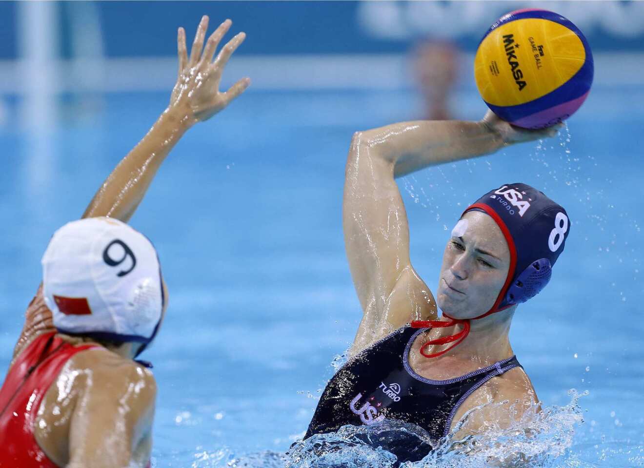 Jessica Steffens of the United States scores a goal against Wang Yi of China.