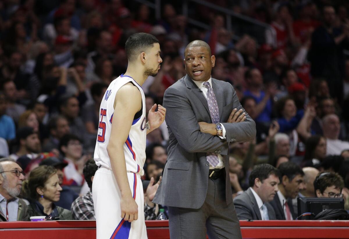 Clippers Coach Doc Rivers, right, returned to Marquette during summers early in his playing career with the Atlanta Hawks to finish his degree. His son, Austin Rivers, plans to do the same at Duke.