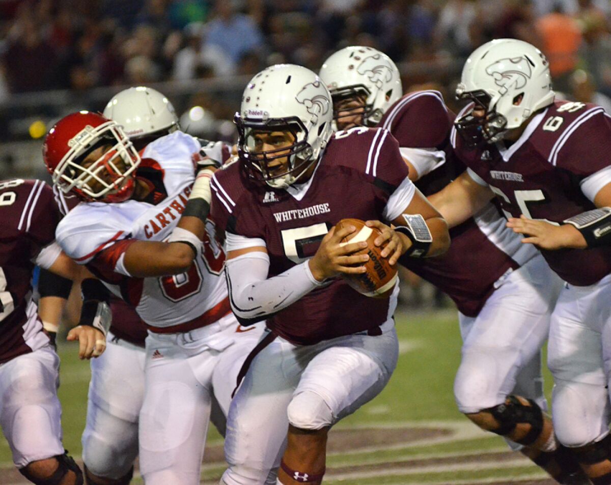 High school quarterback Patrick Mahomes scrambles against the Carthage Bulldogs.