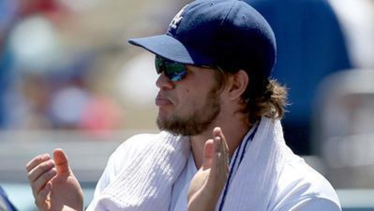 LOS ANGELES, CALIF. - AUG. 24, 2013. Dodgers ace Clayton Kershaw watches the action from the dugout during the game against the Red Sox on iSaturday, Aug. 24, 2013, at Dodger Stadium. (Luis Sinco/Los Angeles Times)