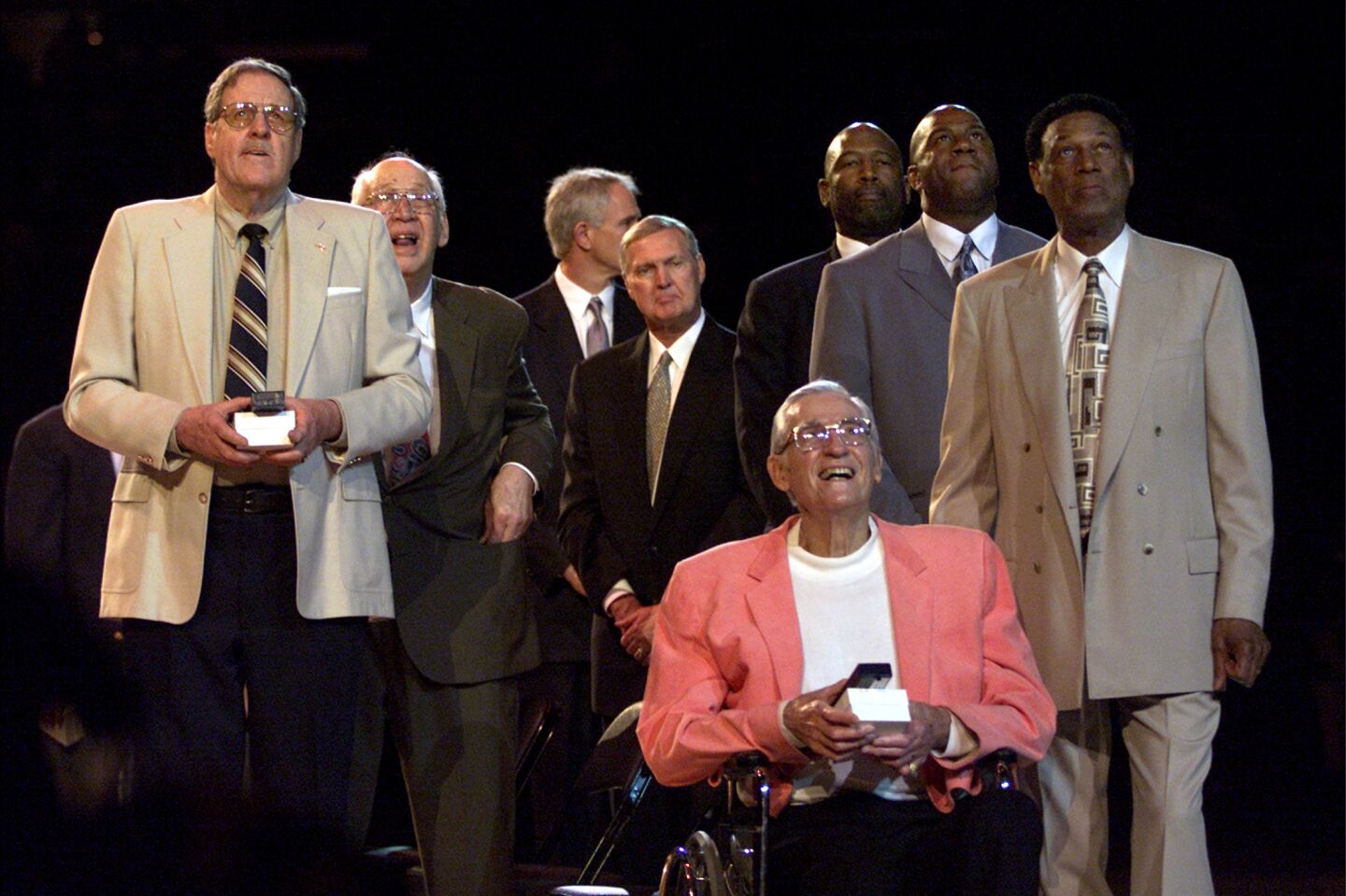 Members of the Minneapolis Lakers Hall of Fame George Mikan, Vern Mikkelsen, Slater Martin, Clyde Lovellette, Coach John Kundla and members of the Los Angeles Lakers Mitch Kupchak, Jerry West, James Worthy, Earvin "Magic" Johnson and Elgin Baylor watch the raising of the Minneapolis banner Thursday at the Staples Center in April of 2002.