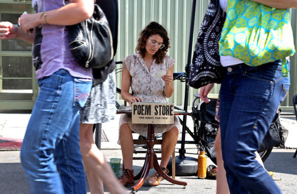 Jacqueline Suskin reads a poem she has written as she waits for customers at her Poem Store at the Hollywood Farmers Market. Each Sunday, Suskin sets up her vintage Hermes typewriter at the market and bangs out poems for anyone who asks.