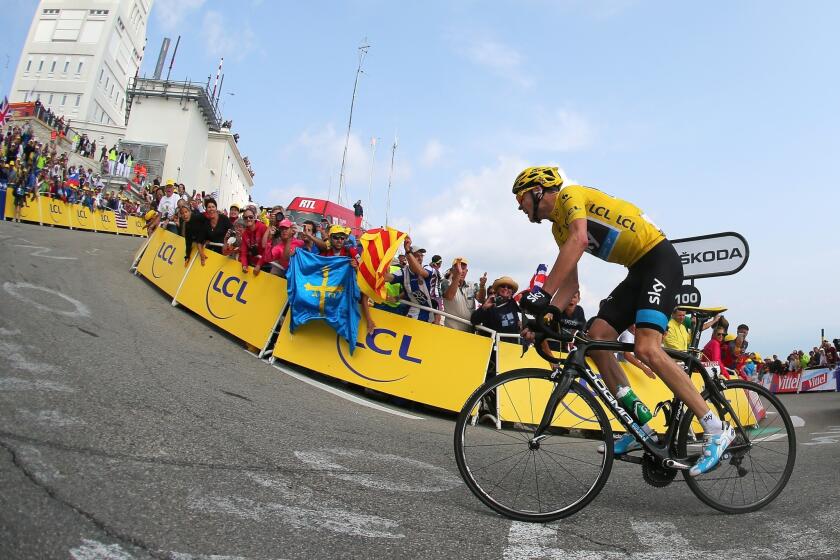 Overall race leader Chris Froome attacks to win Stage 15 of the Tour de France on Sunday.