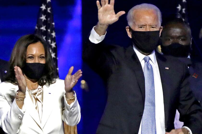 WILMINGTON, DE - NOVEMBER 07: (L-R) Douglas Emhoff, Vice-President-elect Kamal Harris, President-elect Joe Biden and Dr. Jill Biden wave to supporters after defeating Donald Trump in the 2020 U.S. Presidential election on Saturday, Nov.7 , 2020 in Wilmington, DE. (Carolyn Cole / Los Angeles Times)