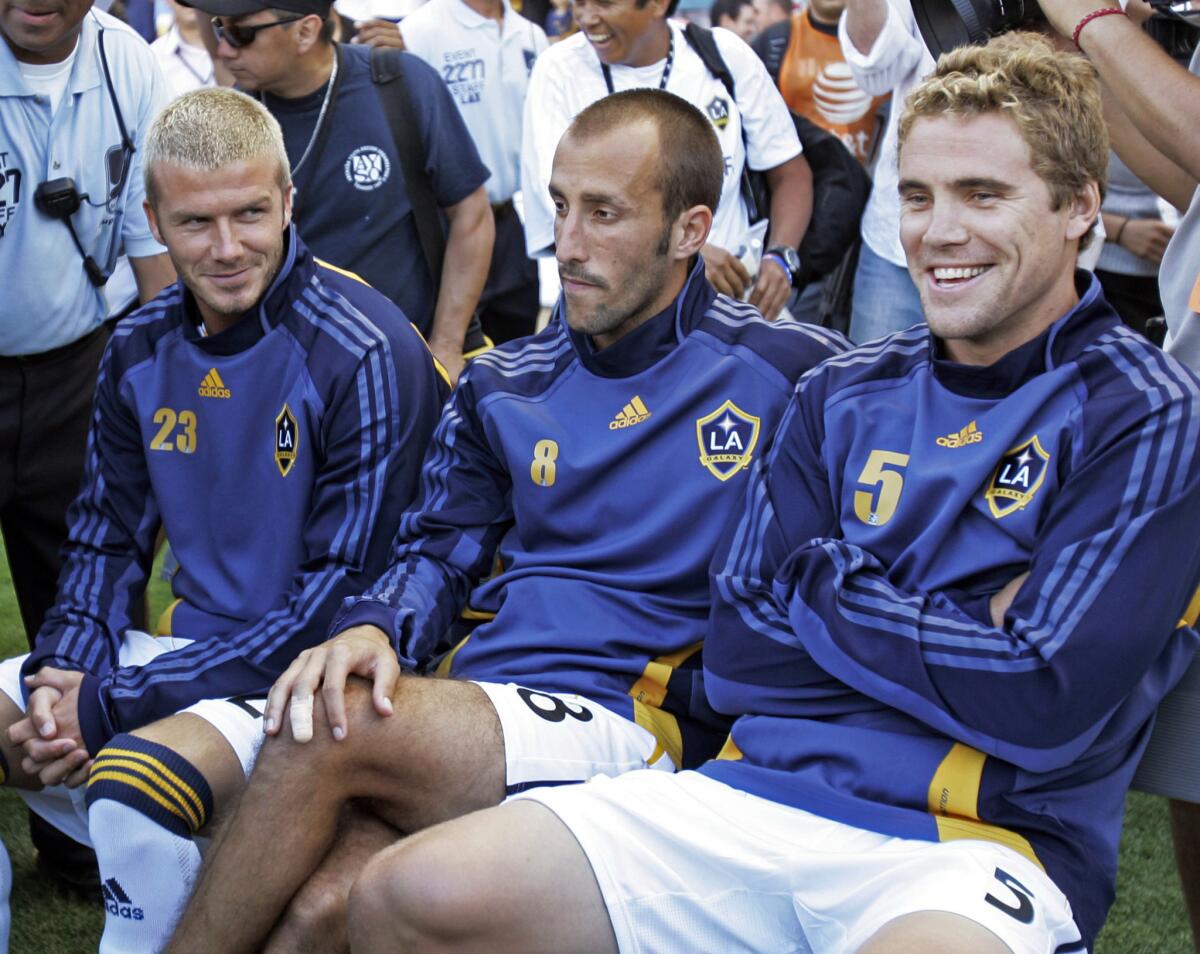 Peter Vagenas, center, sits with Galaxy teammates David Beckham, left, and Chris Albright during a World Series of Football exhibition game on July 21, 2007. The Galaxy announced Vagenas has been chosen to replace Bruce Arena as the team's general manager on Monday.