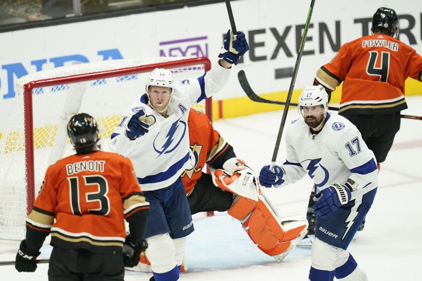Tampa Bay Lightning right wing Corey Perry (10) and left wing Alex Killorn (17) celebrate after left wing Brandon Hagel (38) scored during the third period of an NHL hockey game against the Anaheim Ducks in Anaheim, Calif., Wednesday, Oct. 26, 2022. (AP Photo/Ashley Landis)