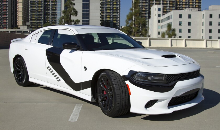 Dodge has partnered with Disney and Lucasfilm to have a little fun co-promoting the new movie "Star Wars: The Force Awakens" by creating a First Order Stormtrooper-themed white Dodge Charger SRT Hellcat.