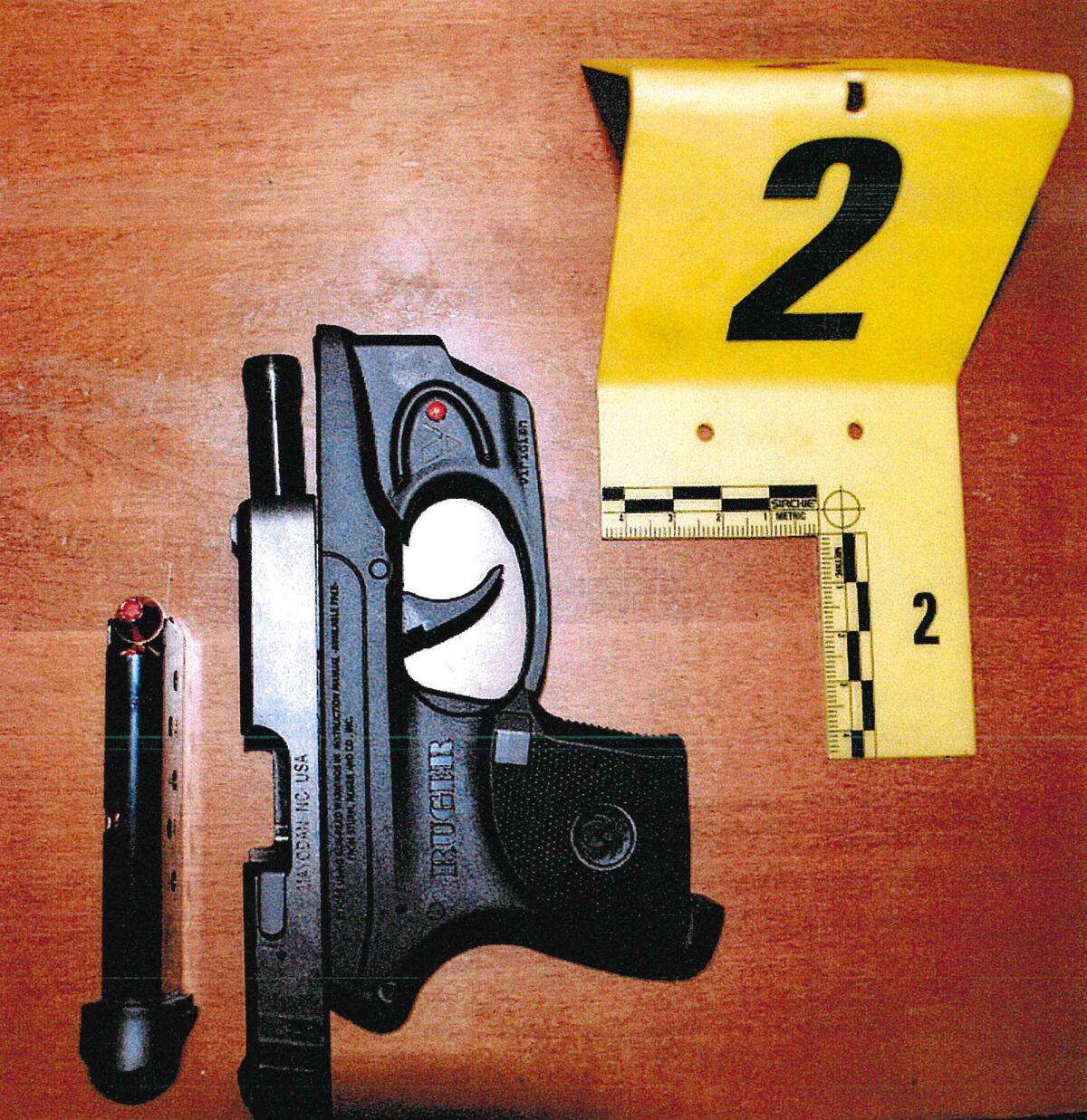 Weapon and ammunition next to an evidence marker