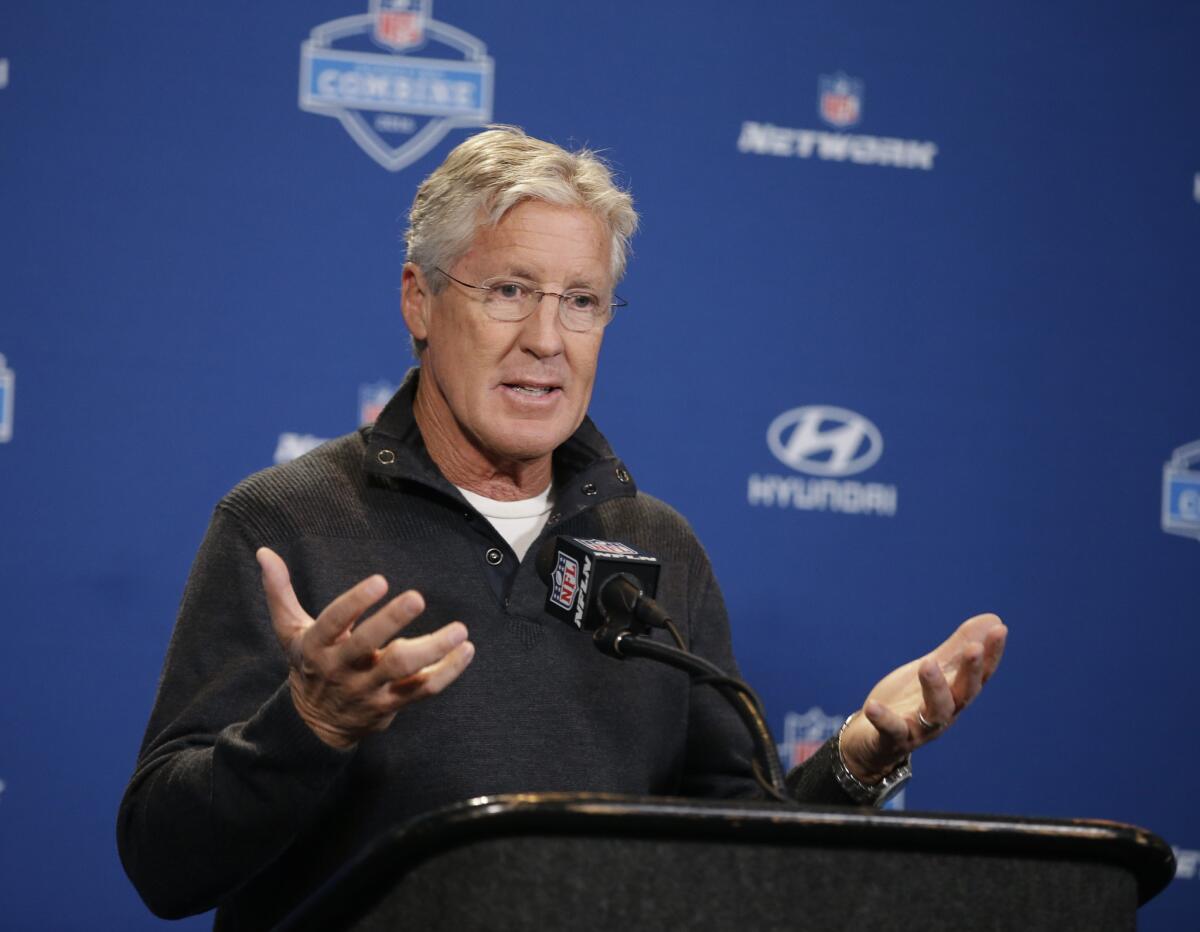 Seattle Seahawks Coach Pete Carroll responds to a question during a news conference at the NFL scouting combine Thursday.