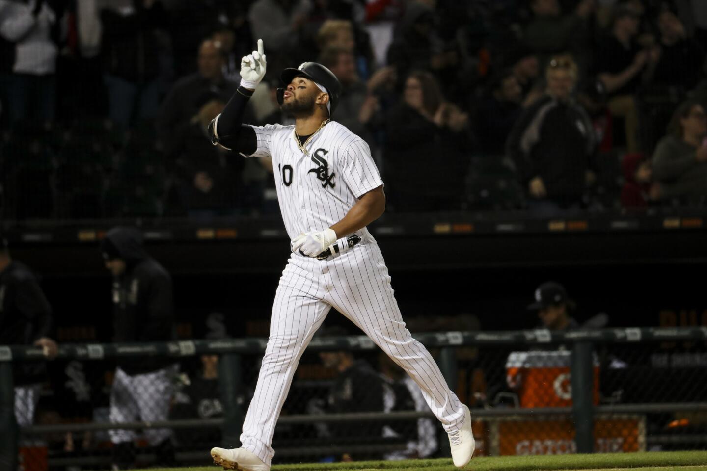 White Sox third baseman Yoan Moncada points up before crossing home plate after hitting a solo homer during the third inning against the Royals on April 16, 2019, at Guaranteed Rate Field.