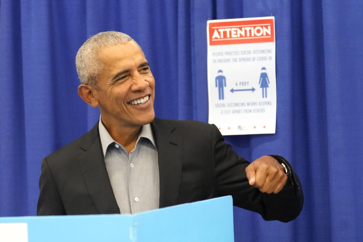 Former President Obama casts his ballot at an early vote venue
