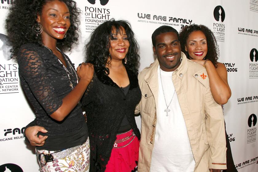 Joni Sledge, second from left, is shown in a 2006 photo with her niece Camille Sledge, left, musician Rodney Jerkins and cousin Amber Sledge. Joni Sledge died Friday at her home in Phoenix.
