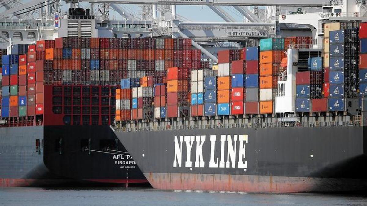 Container ships were stuck outside the Port of Oakland in February, when negotiations between dock workers and shipping companies were at a stalemate.