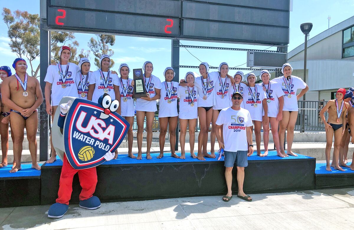 The Newport Beach Water Polo 14-and-under boys won the USA Water Polo Junior Olympics title Tuesday at Irvine's Woollett Aquatics Center. Pictured, left to right: Alexander Altshuler, Peter Castillo, Ben Liechty, Trent Smith, Owen Tift, John Woodruff, Finley LeSieur, Tyler Robison, Carter Loth, Finn Genc, Jack Crosby Wright, Nicholas Kennedy and Maddox Arlett.