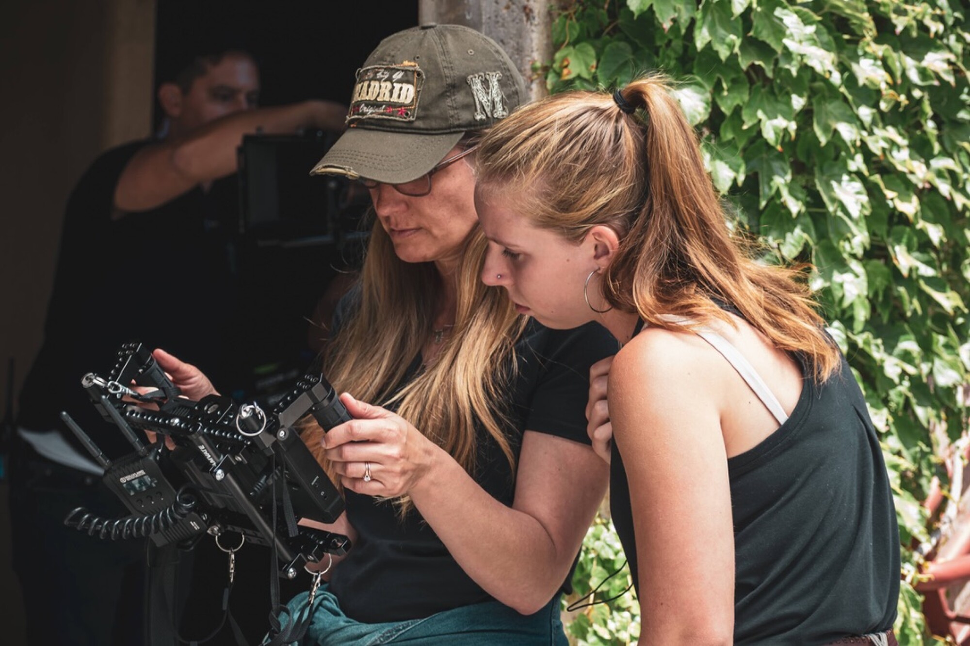 Director Maggie Mahrt, left, reviews a shot with Katie Gerlach during shooting of "O, Brawling Love!"