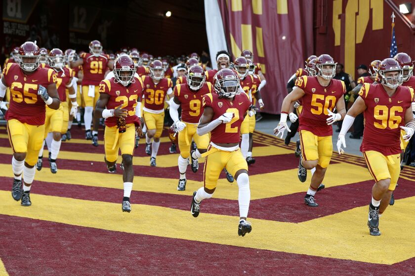 LOS ANGELES, CALIFORNIA - SEPTEMBER 20: The USC Trojans run onto the field for the game against the Utah Utes at Los Angeles Memorial Coliseum on September 20, 2019 in Los Angeles, California. (Photo by Meg Oliphant/Getty Images)