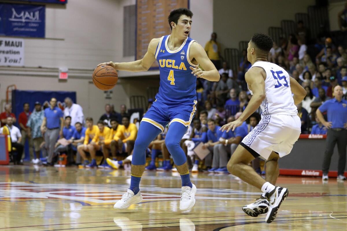 UCLA's Jaime Jaquez Jr. sets up the offense against Chaminade's Isaac Amaral-Artharee on Nov. 26, 2019, in Lahaina, Hawaii.