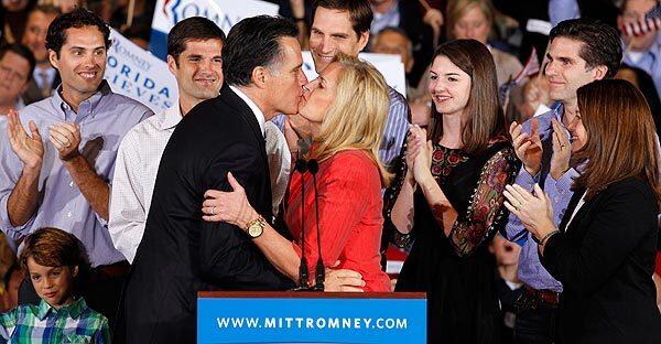 Mitt Romney kisses his wife, Ann