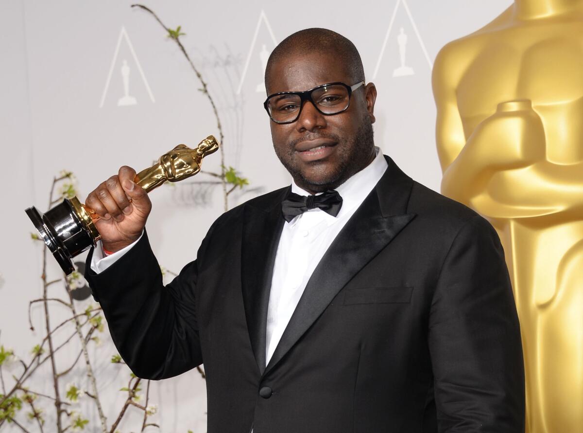 Director and producer Steve McQueen, winner of Best Picture for "12 Years a Slave," poses in the press room during the Oscars.