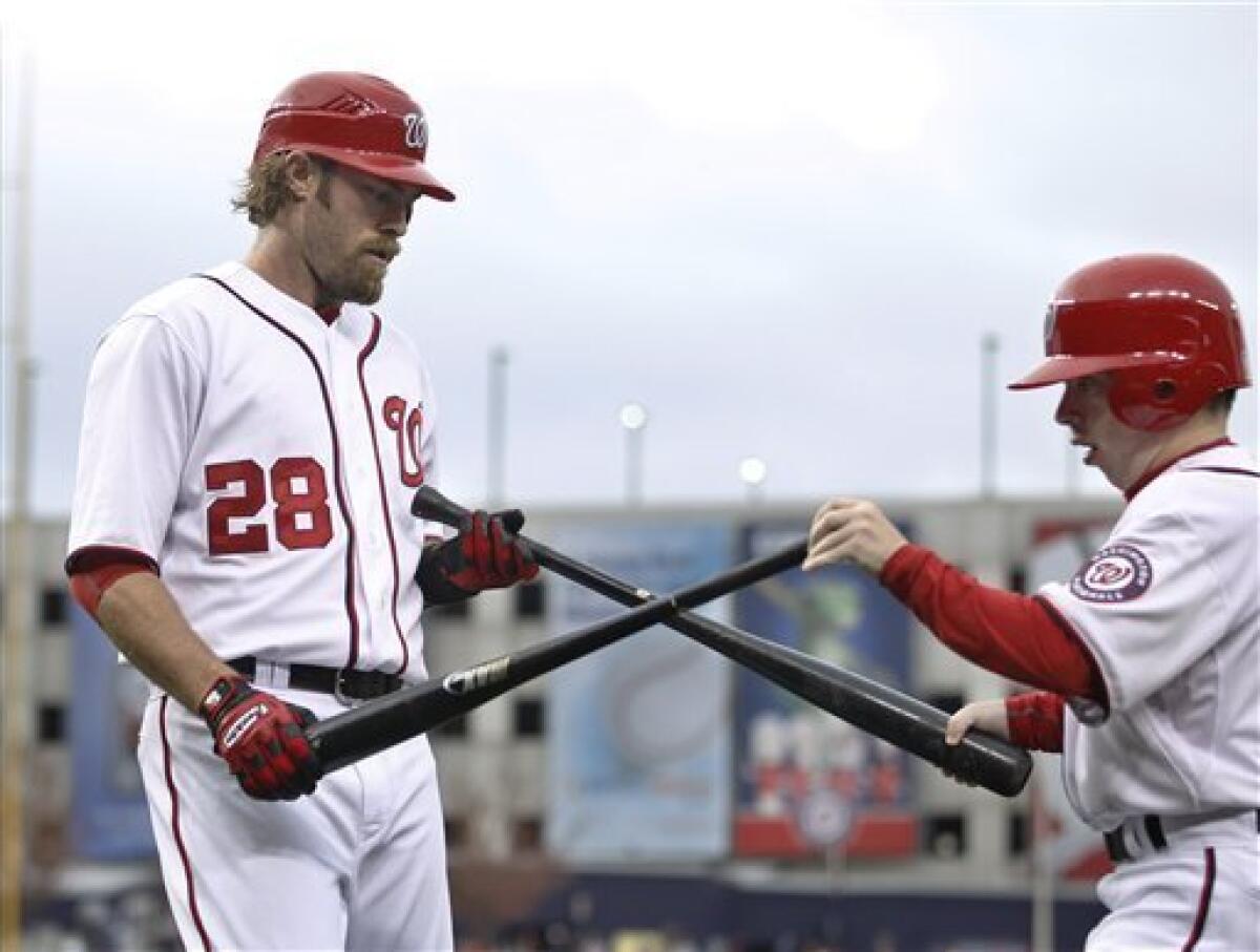 Jayson Werth of the Washington Nationals tosses his bat after