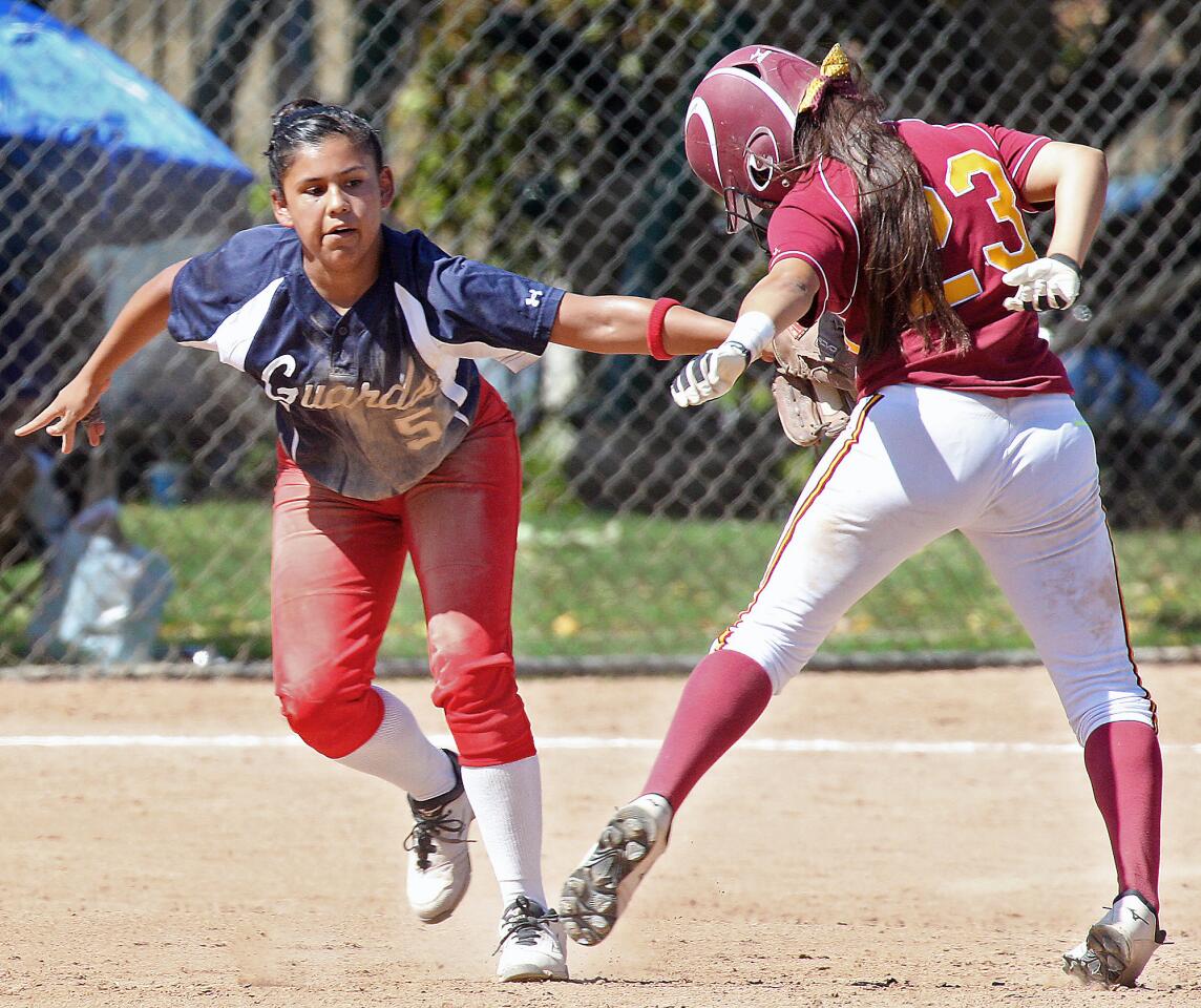 Bell Jeff's Tiffany Galindo tags Cantwell's Alexis Pintado out during a CIF vSS Division VI semifinal game on Tuesday, May 27, 2014. Bell Jeff lost 5-3.
