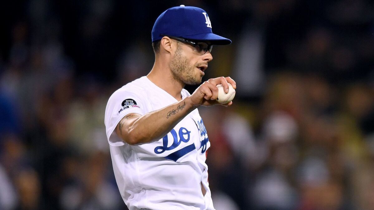 Dodgers reliever Joe Kelly reacts after the final out of a 9-4 victory over the Atlanta Braves on May 8. Kelly has given up runs in eight of his 15 appearances this season.