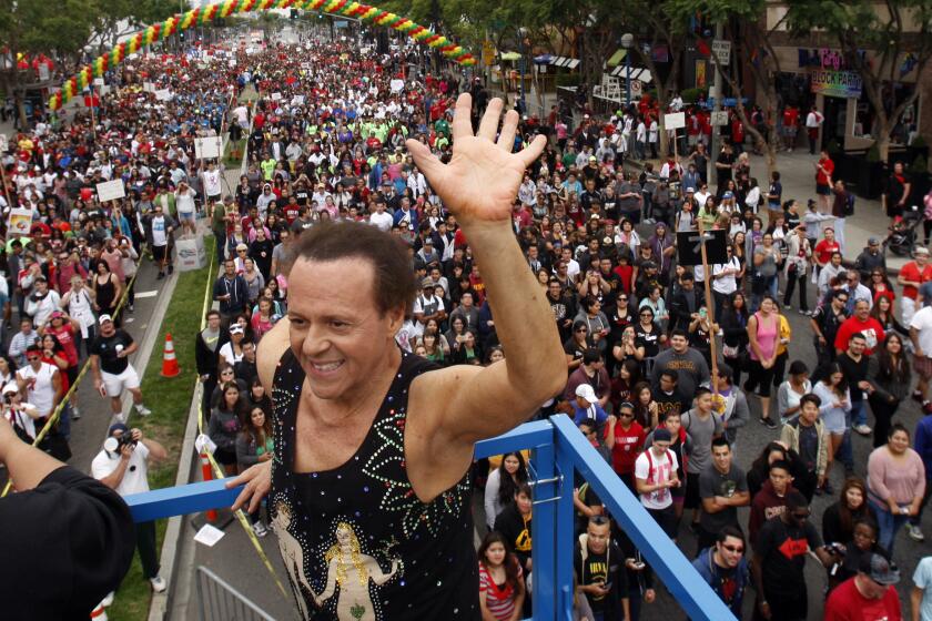 WEST HOLLYWOOD, CA-OCT. 13, 2013: Fitness personality and actor Richard Simmons, who warmed up the crowd with an exercise routine, cheers on the 25,000 people participating in the 29th annual AIDS Walk Los Angeles to benefit AIDS Project Los Angeles and other local AIDS service organizations Sunday, Oct, 13, in West Hollywood. (Photo By Allen J. Schaben / Los Angeles Times)