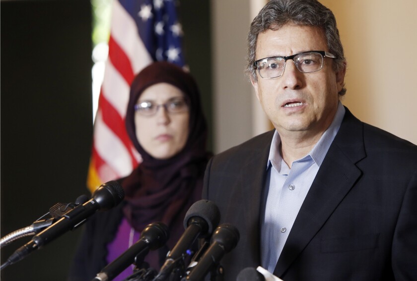 Muslim community leader Khalid Hamideh, right, and Alia Salem, executive director of the Council on American-Islamic Relations, hold a news conference condemning the two gunmen who staged an attack outside a contest in Garland, Texas, for cartoons depicting the prophet Muhammad.
