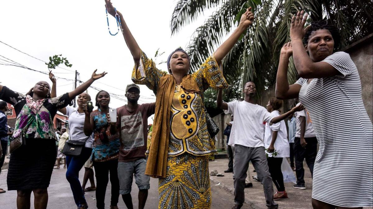 Congolese protesters outside St. Francis de Sales Church in Kinshasa, the capital, on Feb. 25 call for President Joseph Kabila to resign.