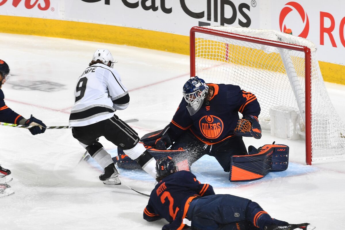 Kings forward Adrian Kempe scores the game-winning overtime goal past Oilers goaltender Mike Smith in Game 5. 