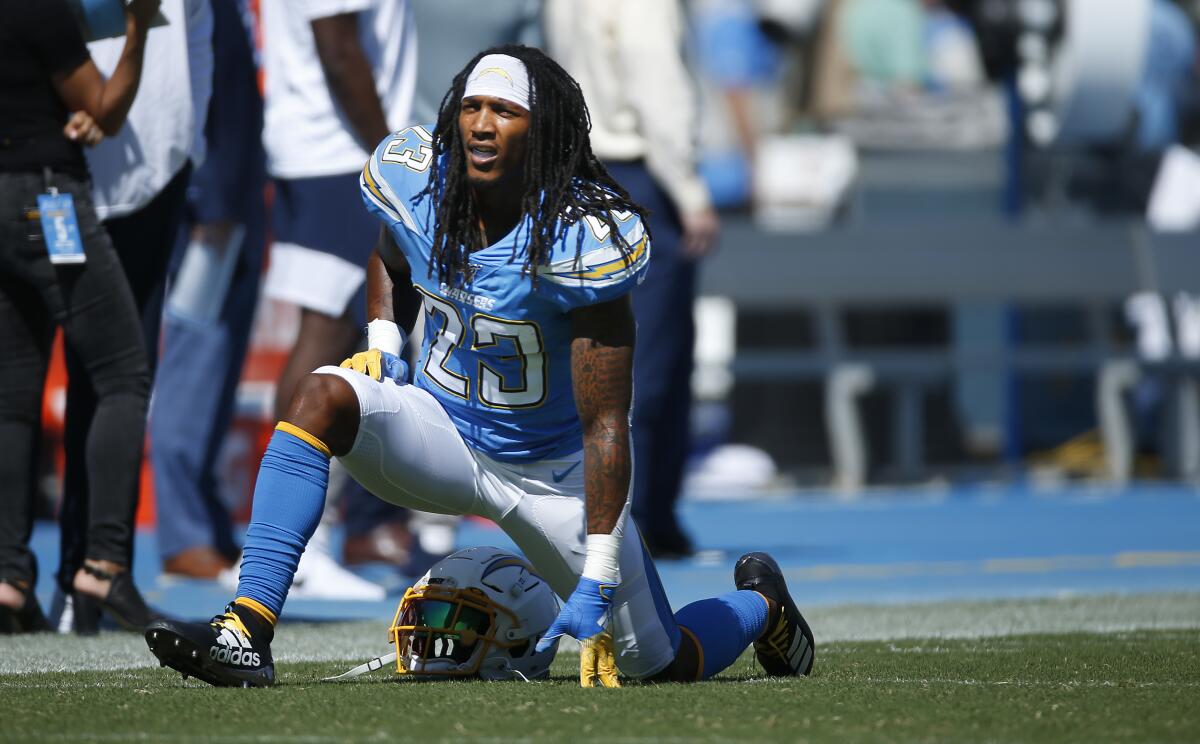 Chargers Rayshawn Jenkins warms up before a game against the Denver Broncos in Carson last season.