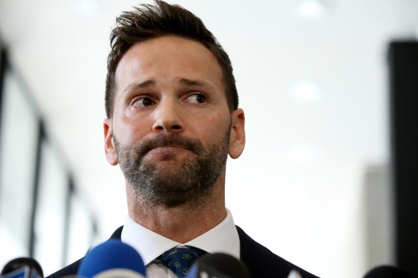 Former U.S. Rep. Aaron Schock appears March 6, 2019 after his scheduled hearing at the U.S. Dirksen Courthouse in Chicago. Federal prosecutors have agreed to drop all charges against him if he pays back money he owes to the Internal Revenue Service and his campaign fund.