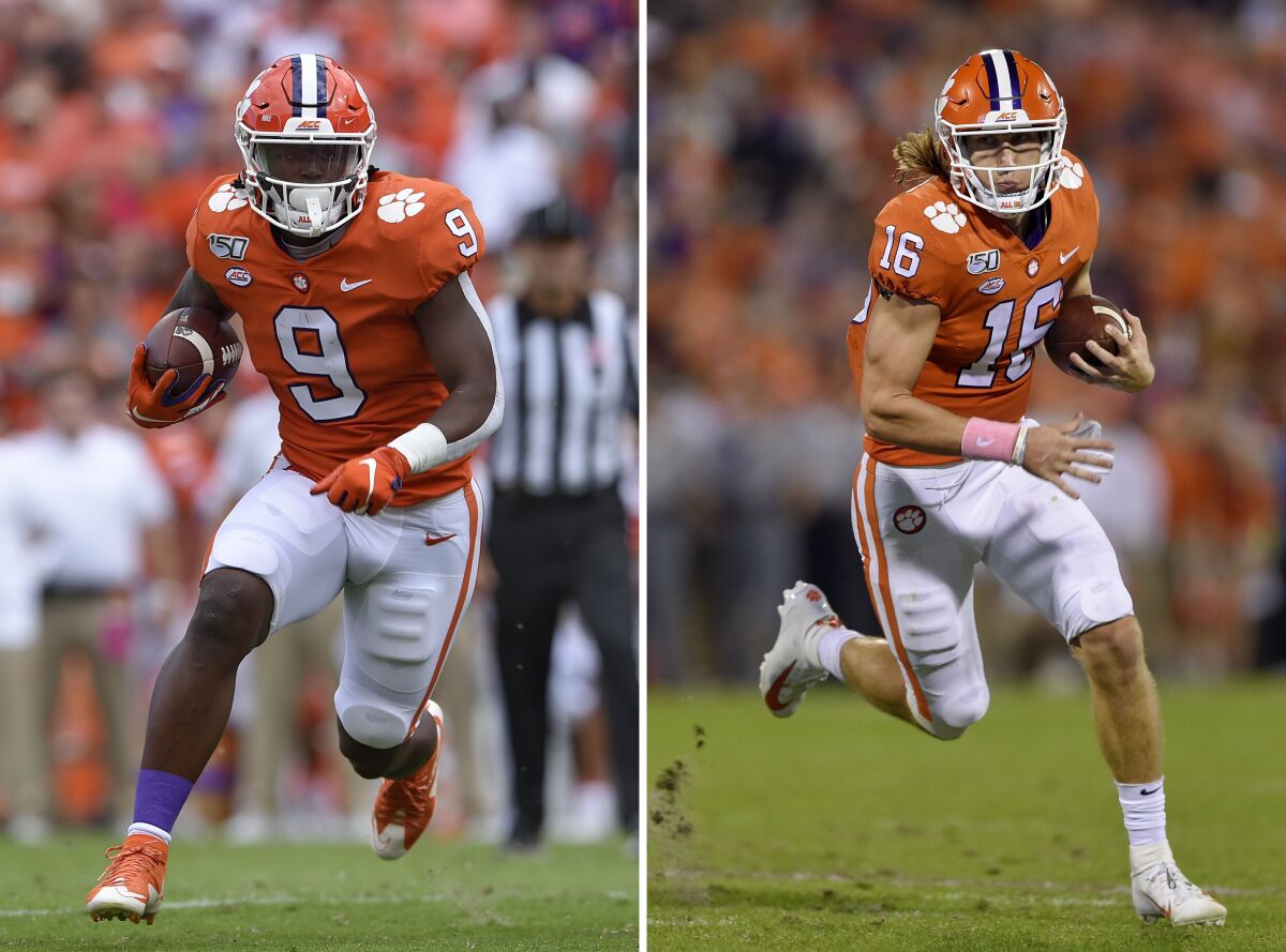 FILE - At left, in a Saturday, Oct. 12, 2019, file photo, Clemson's Travis Etienne runs out of the backfield to score a touchdown during the first half of an NCAA college football game against Florida State, in Clemson, S.C. At right, in a Saturday, Oct. 26, 2019, file photo, Clemson's Trevor Lawrence rushes on a quarterback keeper during the first half of an NCAA college football game against Boston College, in Clemson, S.C. Clemson quarterback Trevor Lawrence and tailback Travis Etienne love competing on the same side with the top-ranked Tigers. If they keep playing as they have, they may be competing against each other for college football's biggest individual prize, the Heisman Trophy. (AP Photo/Richsard Shiro, File)