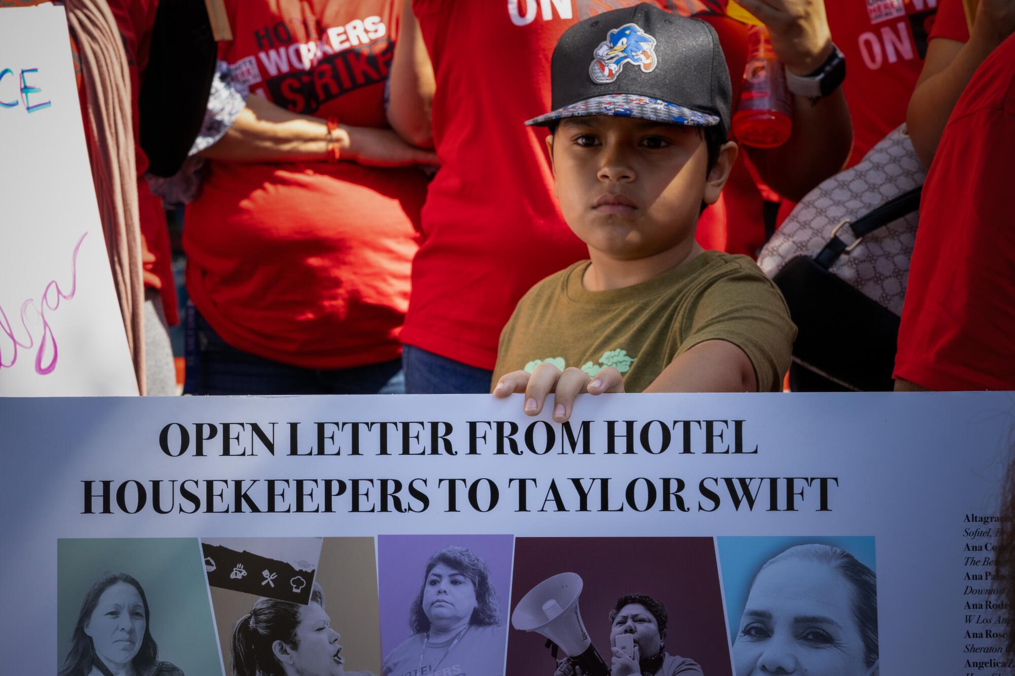 Dylan Galvez, 8, at a rally of striking hotel workers