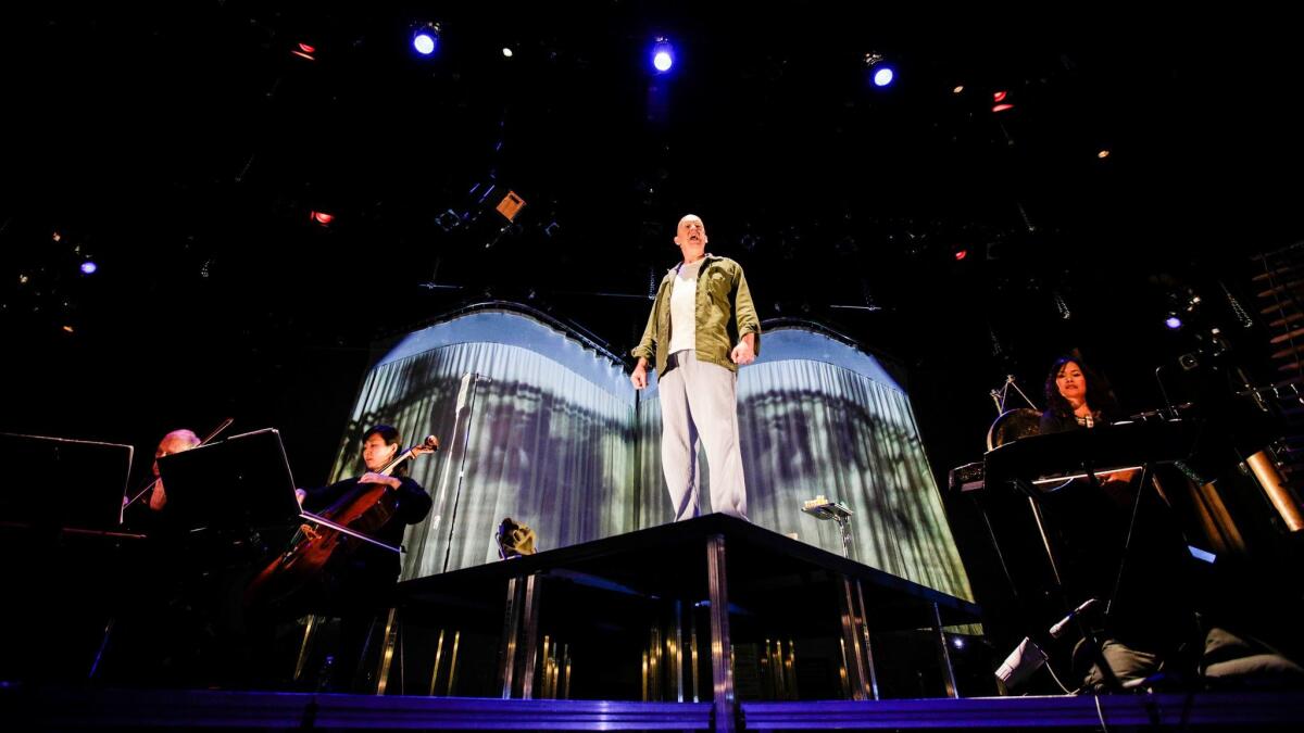 Kronos Quartet (left), tenor Rinde Eckert (center) and Vân-Ánh Võ (right) perform Jonathan Berger's opera, 'My Lai," at UCLA's Royce Hall