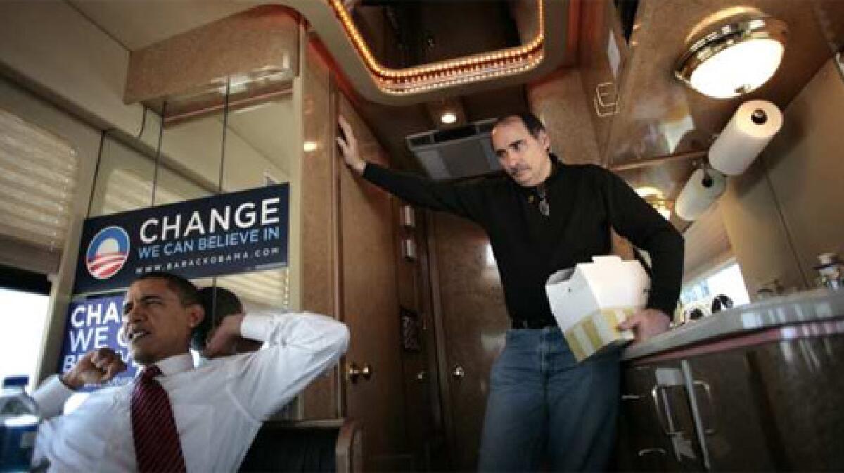 NAVIGATOR: Axelrod, right, and Obama on the campaign bus in Iowa, a day before victory in the caucuses there shook assumptions about the presidential race.