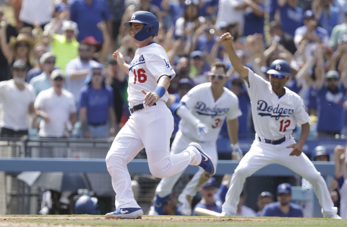 Dodgers catcher Will Smith scores on Russell Martin's walkoff single in the ninth inning to beat the Cardinals 2-1 on Wednesday at Dodger Stadium.