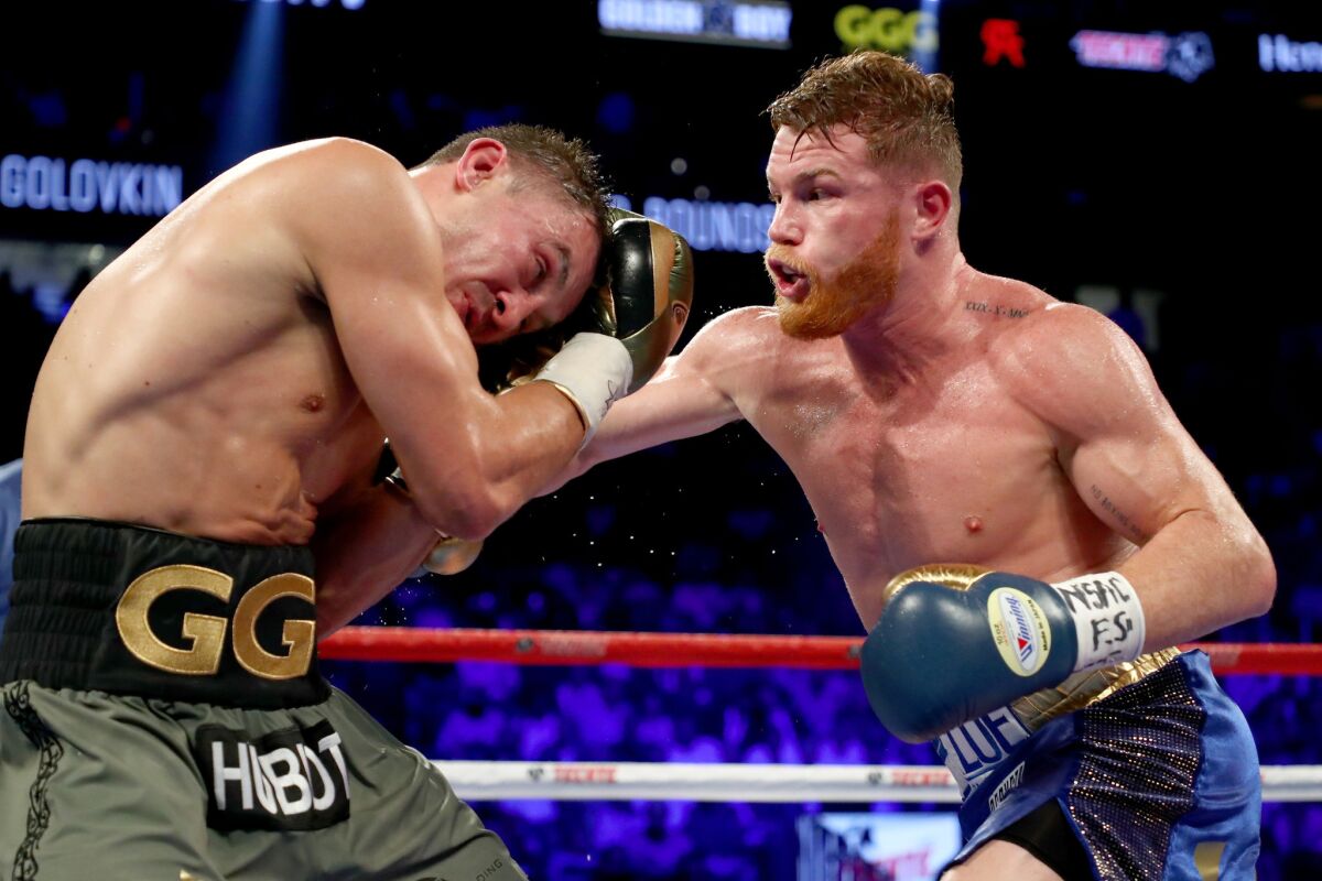 Canelo Alvarez works a combination against Gennady Golovkin during their middleweight title fight.