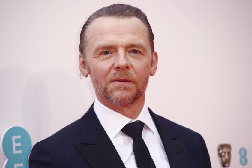 Simon Pegg poses for photographers upon arrival at the 75th British Academy Film Awards, BAFTA's, in London Sunday, March 13, 2022. (Photo by Joel C Ryan/Invision/AP)